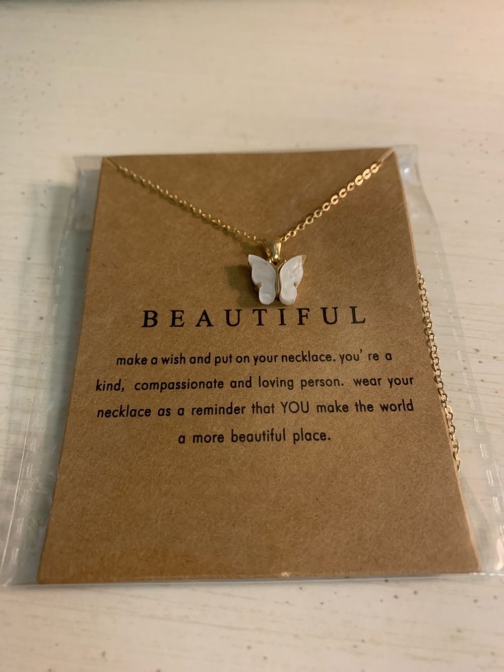 Goldtone Butterfly Pendant Necklace with White Inlay